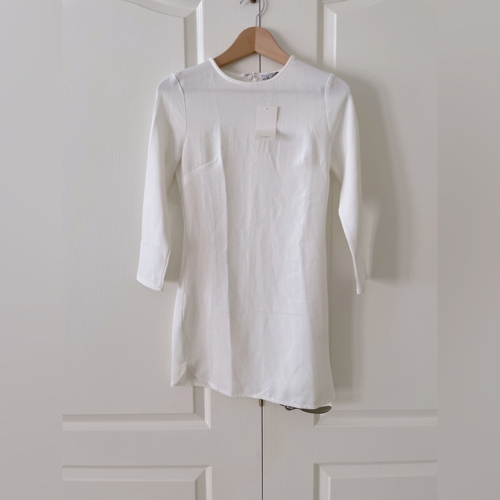 White long sleeve dress. New with tags size Small